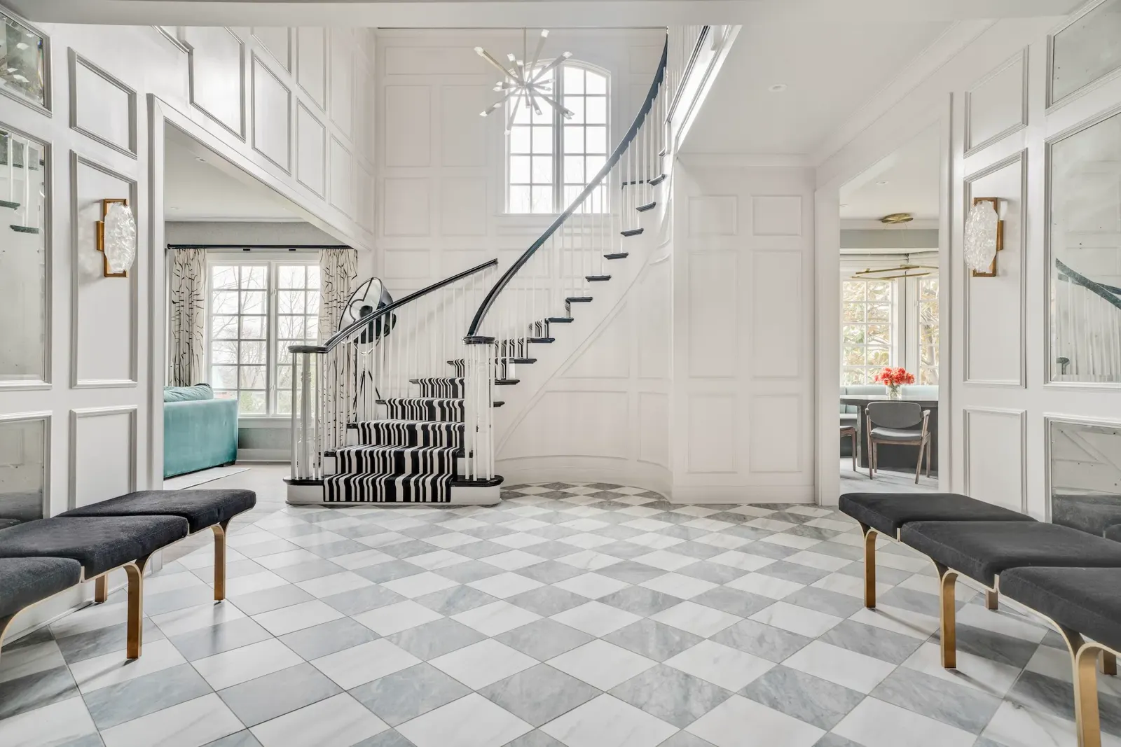 Sculptural black and white staircase in a refined New Jersey residence