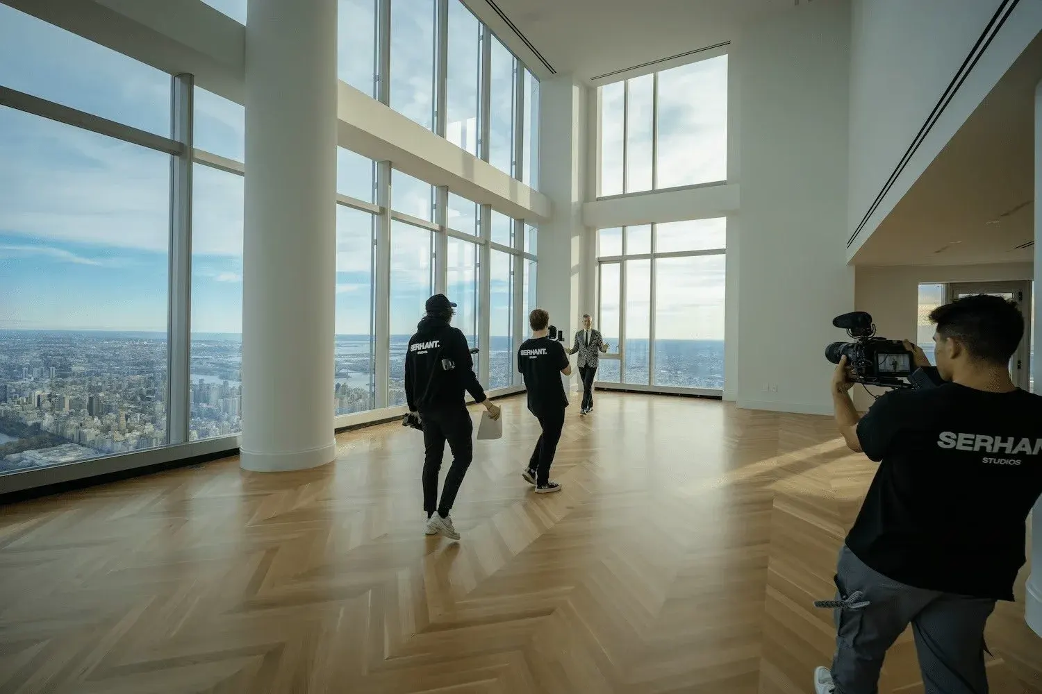 SERHANT. Studios film crew producing content in a New York City penthouse